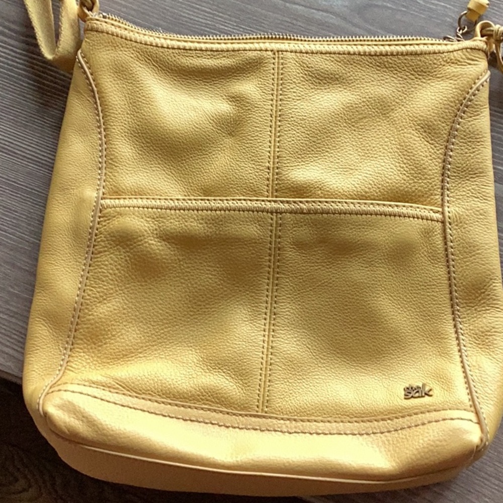 The Sak bright yellow crossbody.  Canvas strap with leather shoulder protector
